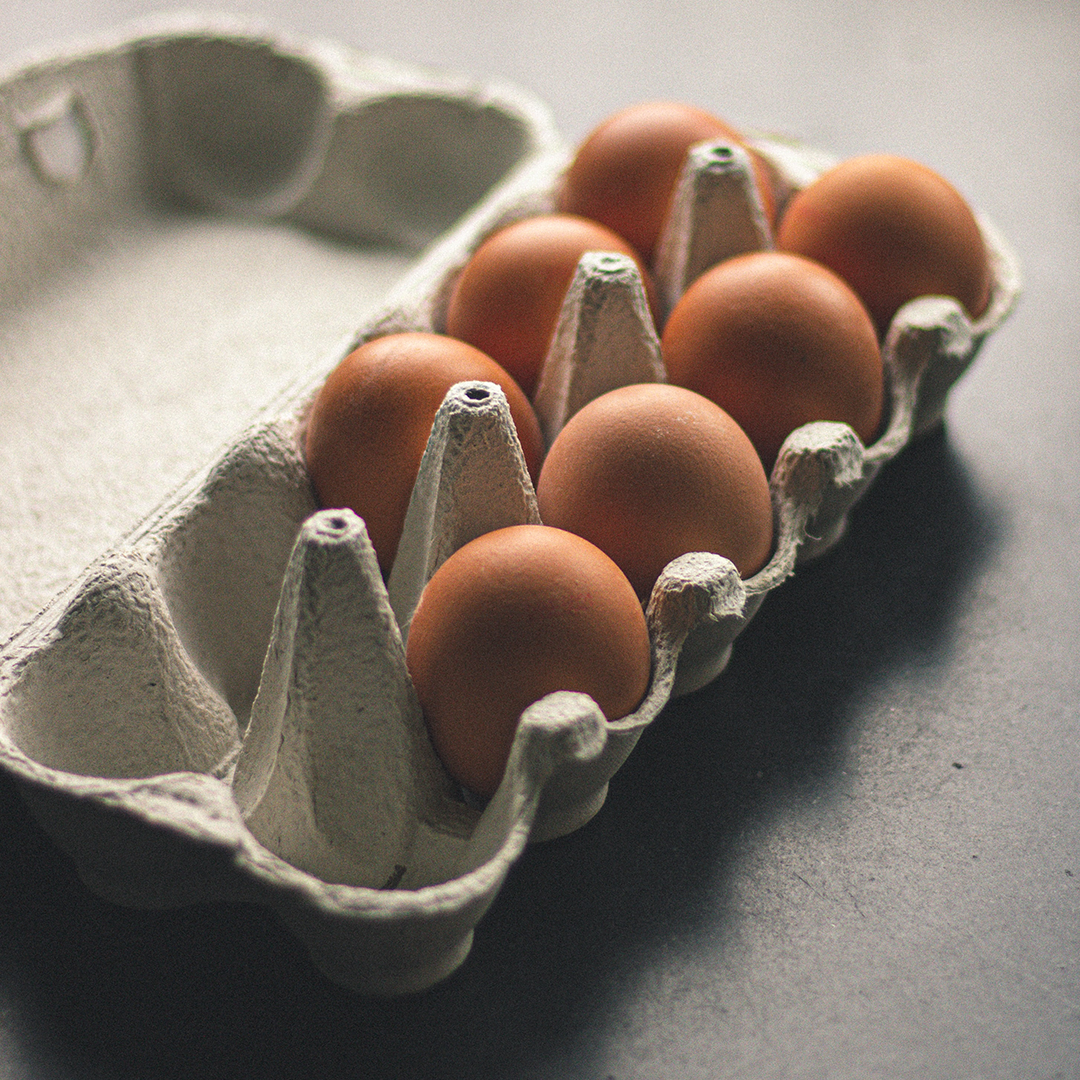 A close-up of Soil and Soul Farm's pasture-raised eggs in an opened carton